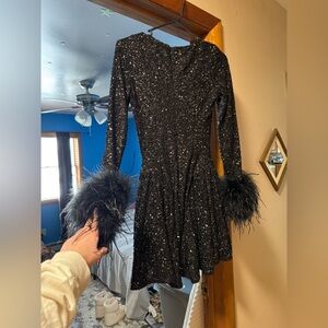 Club London black sequin dress with feather sleeves